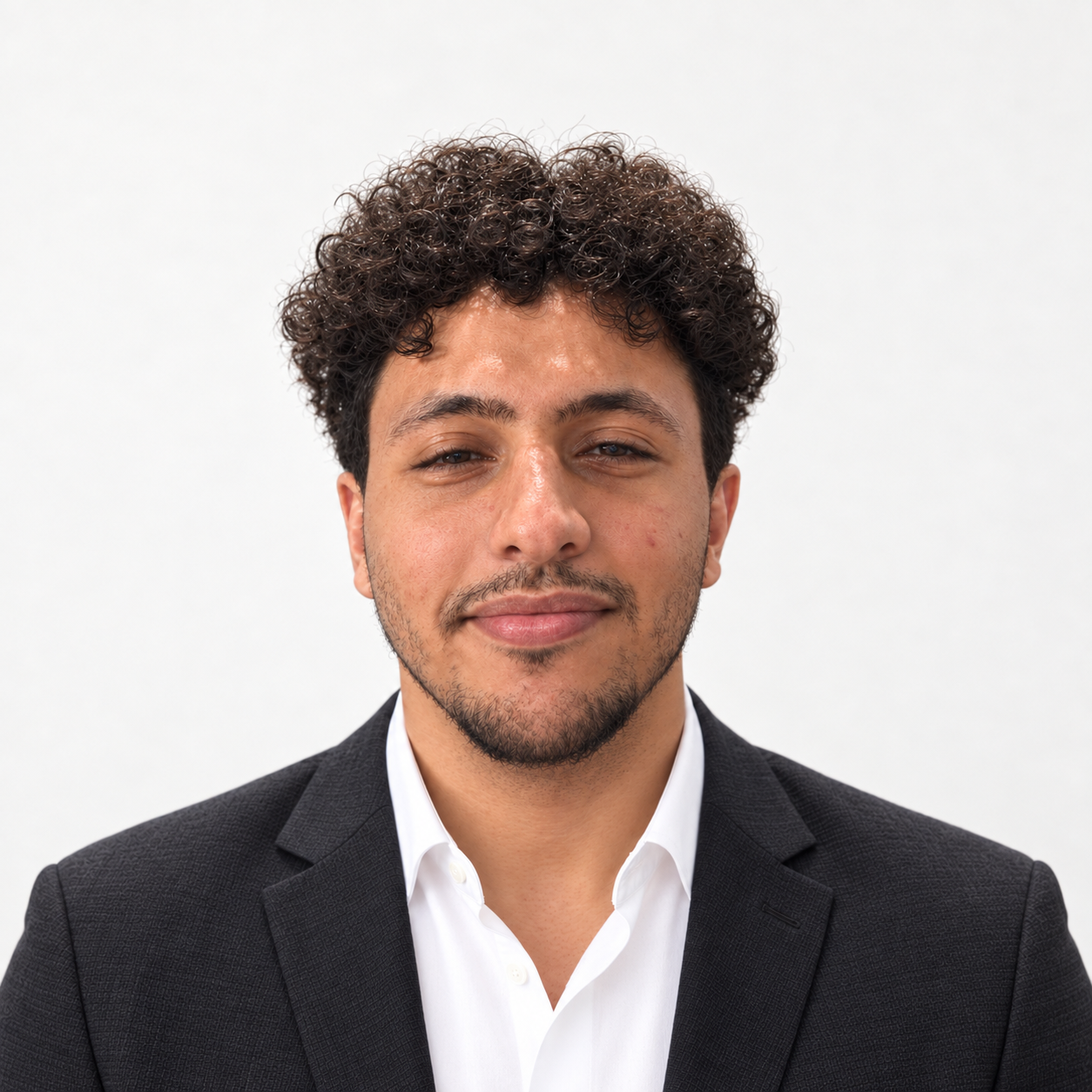 Salah Alhudais wearing a charcoal blazer